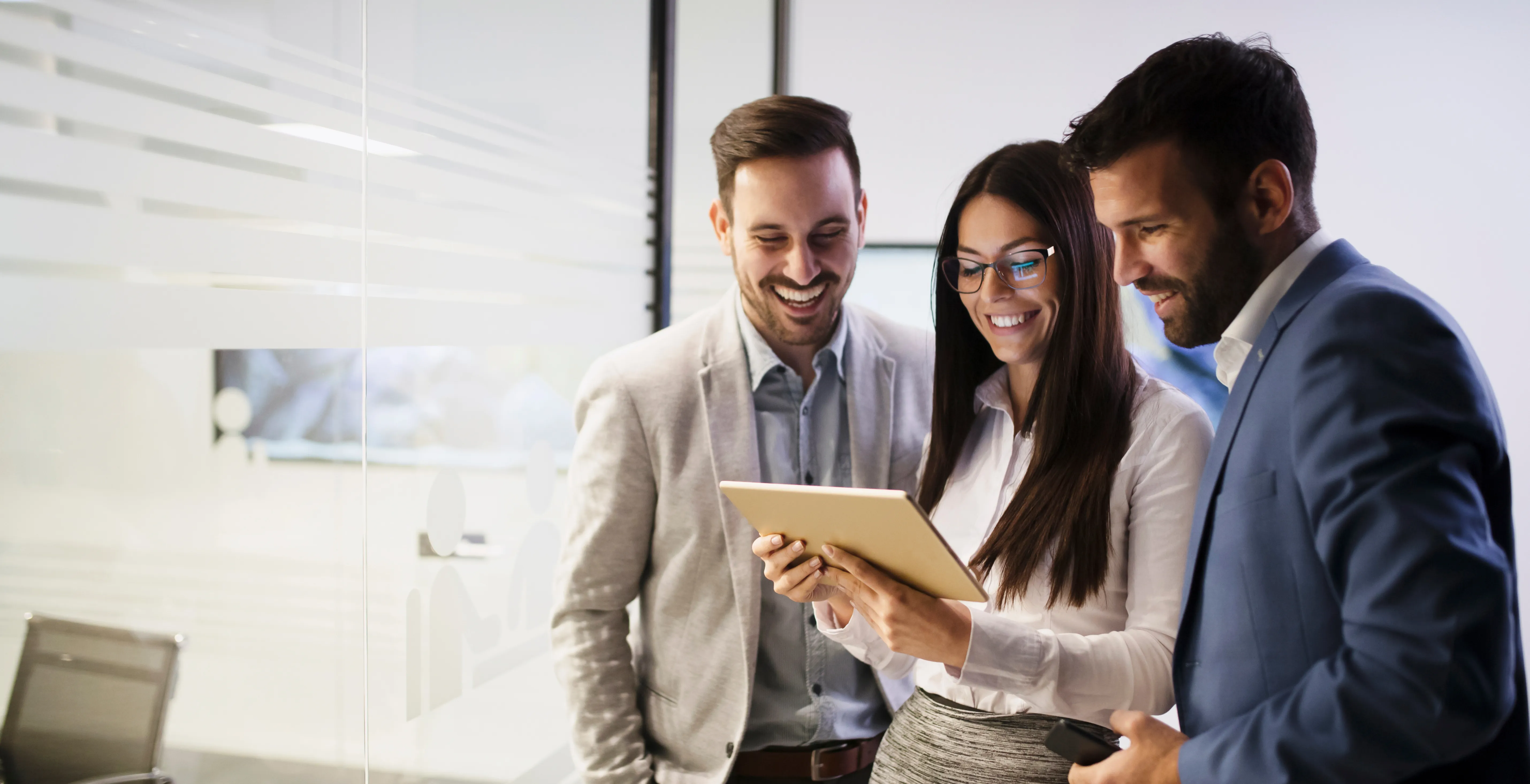 team members reviewing ai coaching insight that is integrated with behavioral assessment data